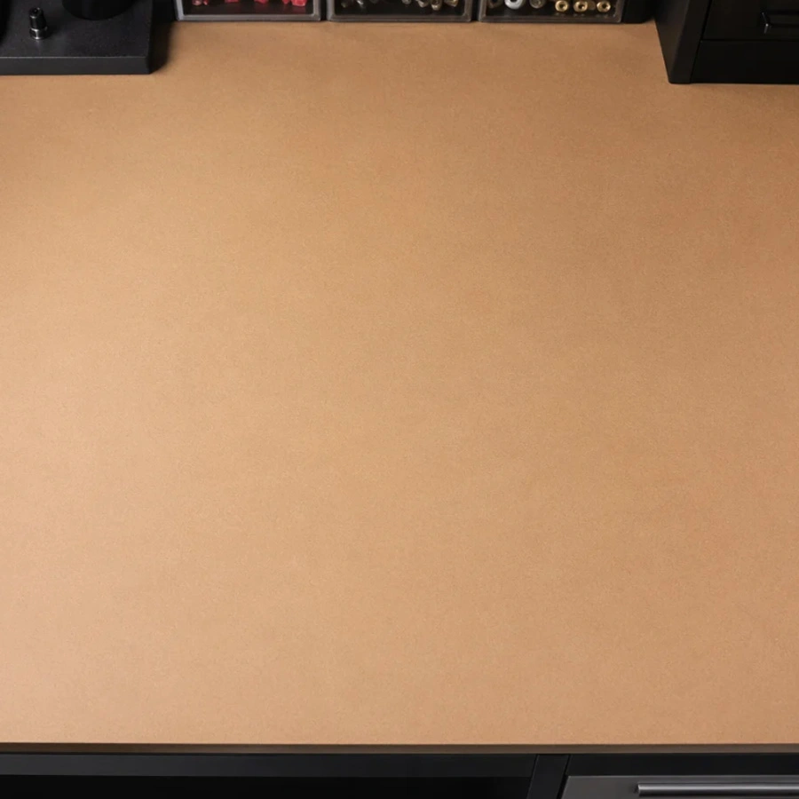 A perfectly flat MDF workbench top with dog holes drilled for woodworking clamps